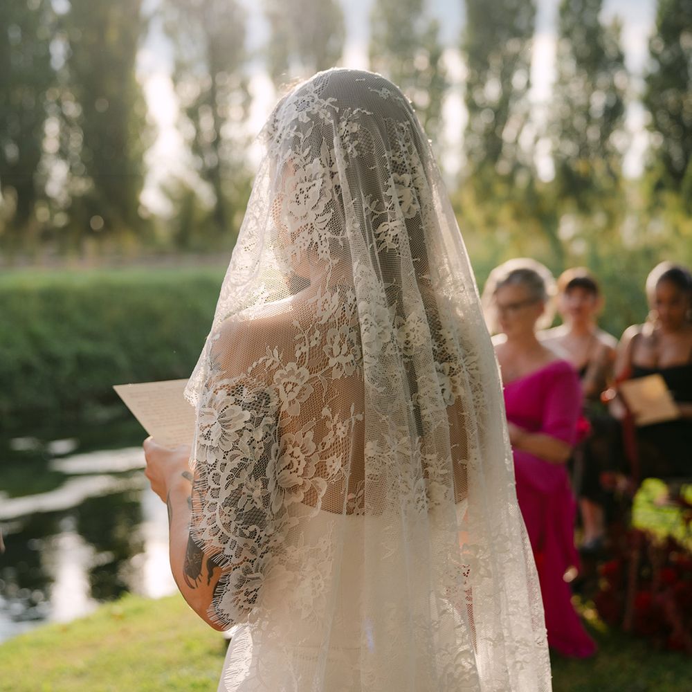 bride-wears-delicate-lace-drop-veil