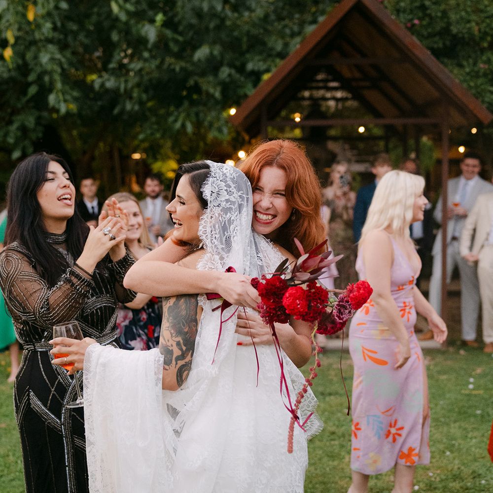 bridesmaids-hug-the-bride