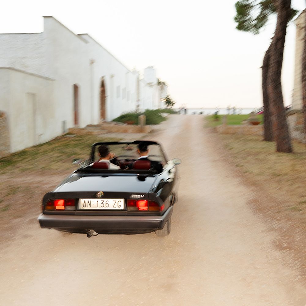 grooms-in-vintage-wedding-car