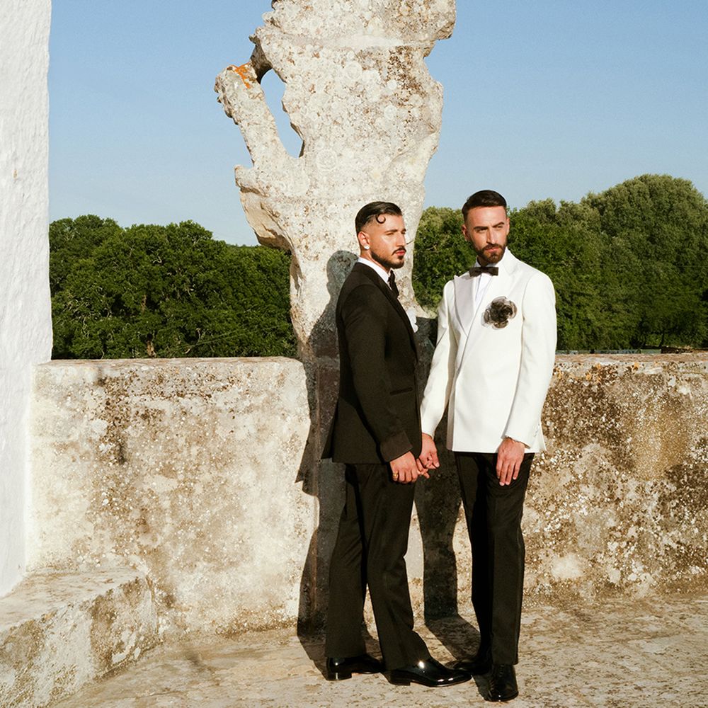 grooms-pose-togther-in-mismatched-suits