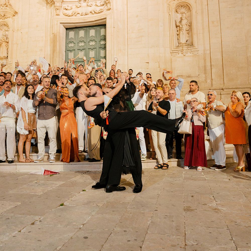 guests-celebrate-as-grooms-kiss