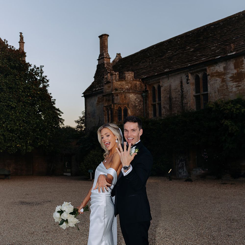 bride-and-groom-show-off-their-wedding-rings