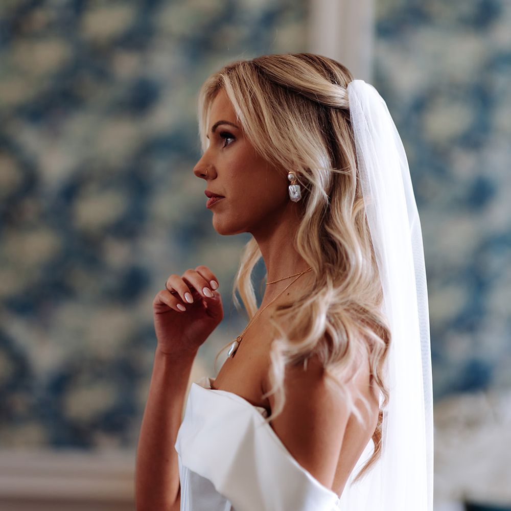 bride-wearing-pearl-wedding-earrings