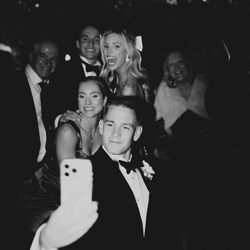 guests-and-bride-and-groom-pose-for-selfie