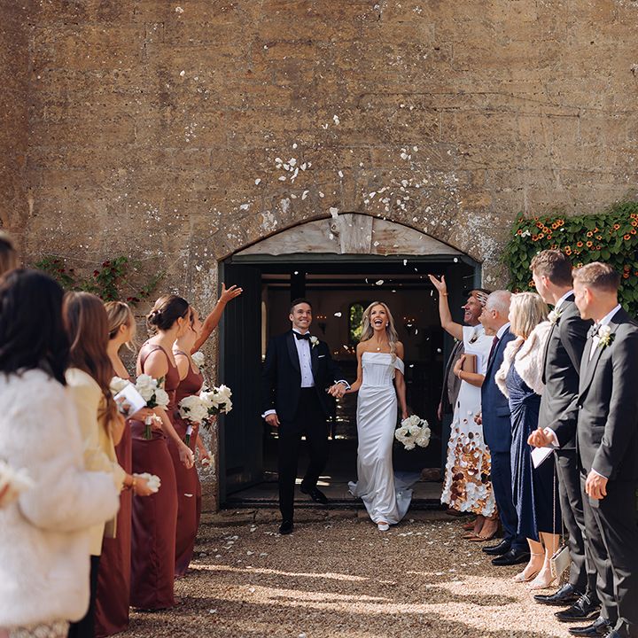 white-confetti-moment-as-couple-exit-ceremony