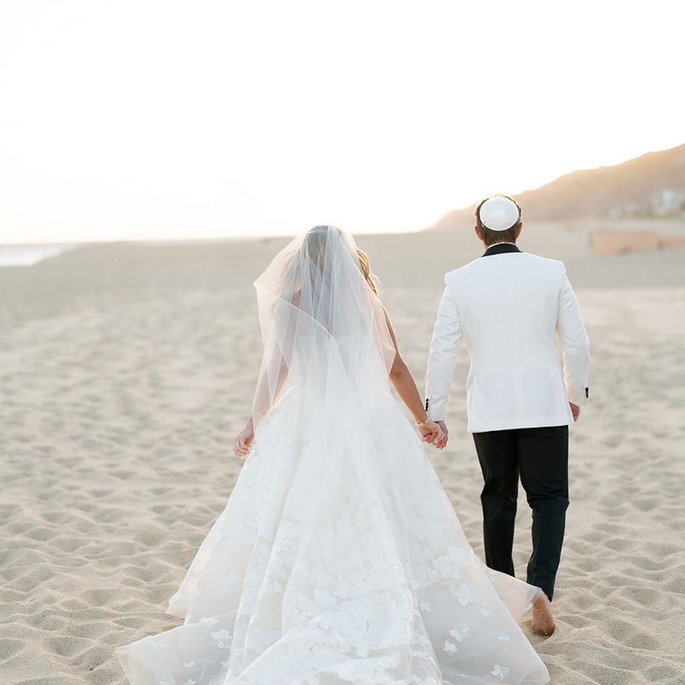 bride-and-groom-walking-along-beach