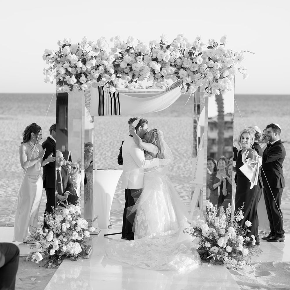first-kiss-moment-at-beach-wedding