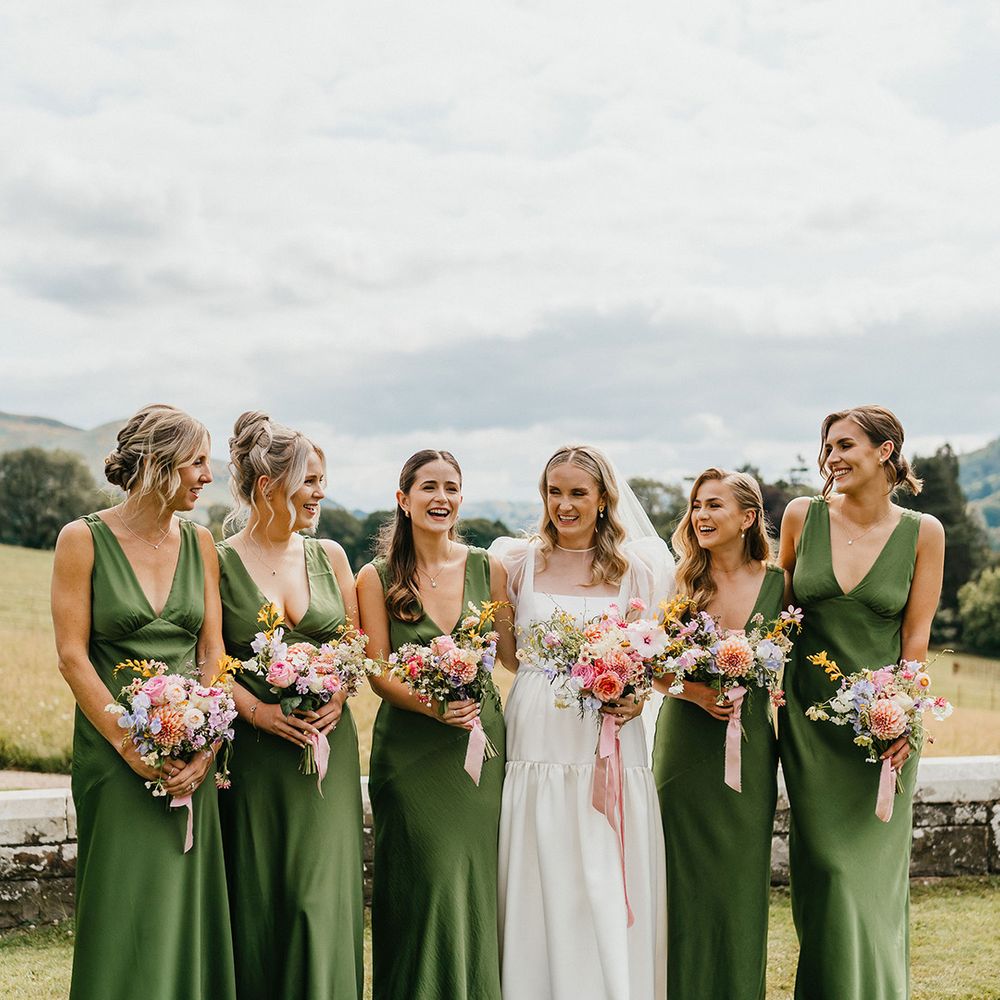 bridal-party-in-green-satin-bridesmaid-dresses-with-pastel-bouquets