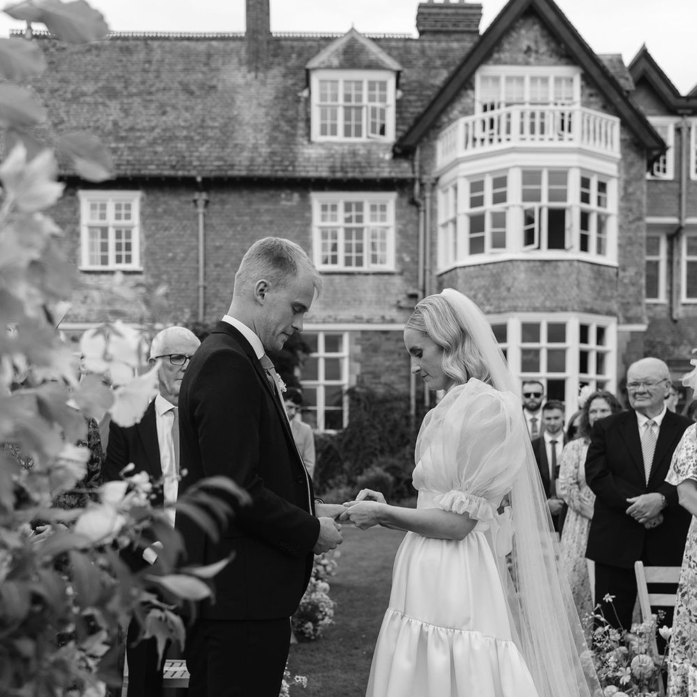 bride-and-groom-exchange-wedding-rings