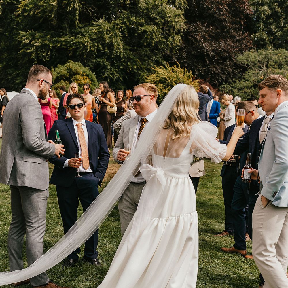 bride-in-puff-sleeve-bow-back-wedding-dress