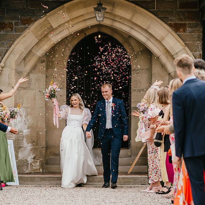 Confetti moment for couple exiting wedding ceremony