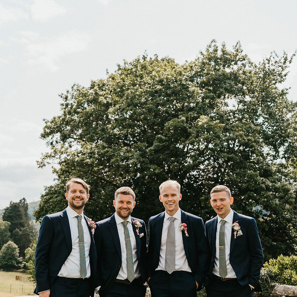 groom-and-groomsmen-in-matching-blue-suits