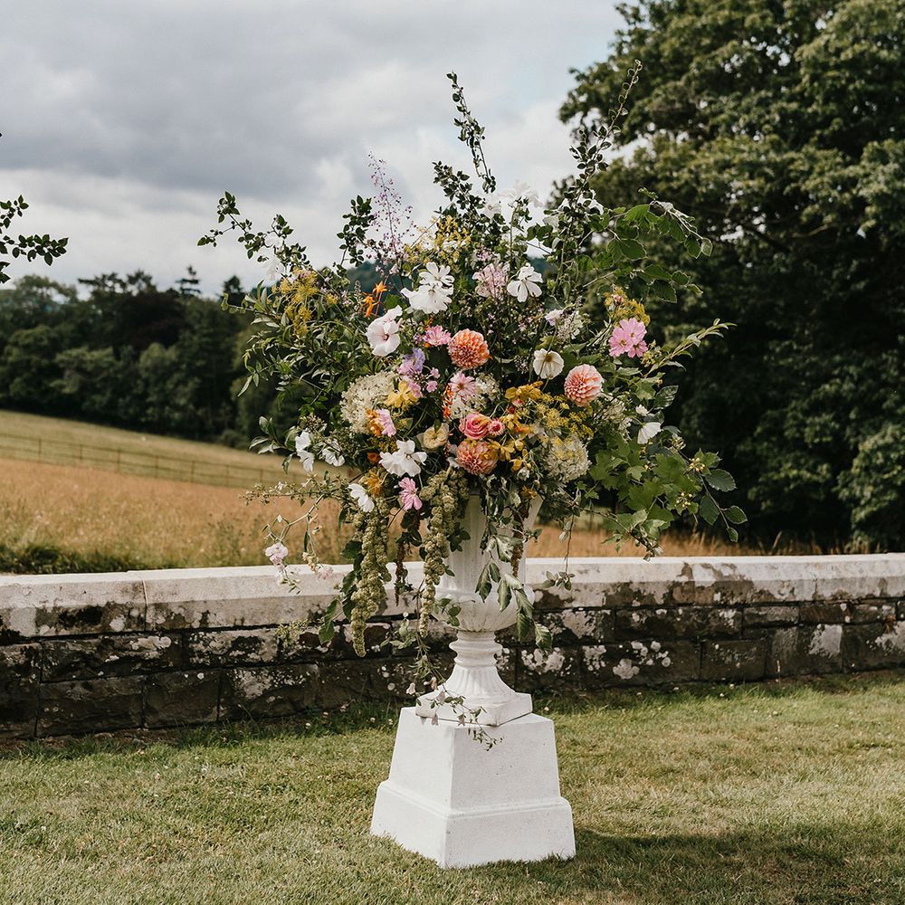 pink-wedding-flowers-in-white-urns