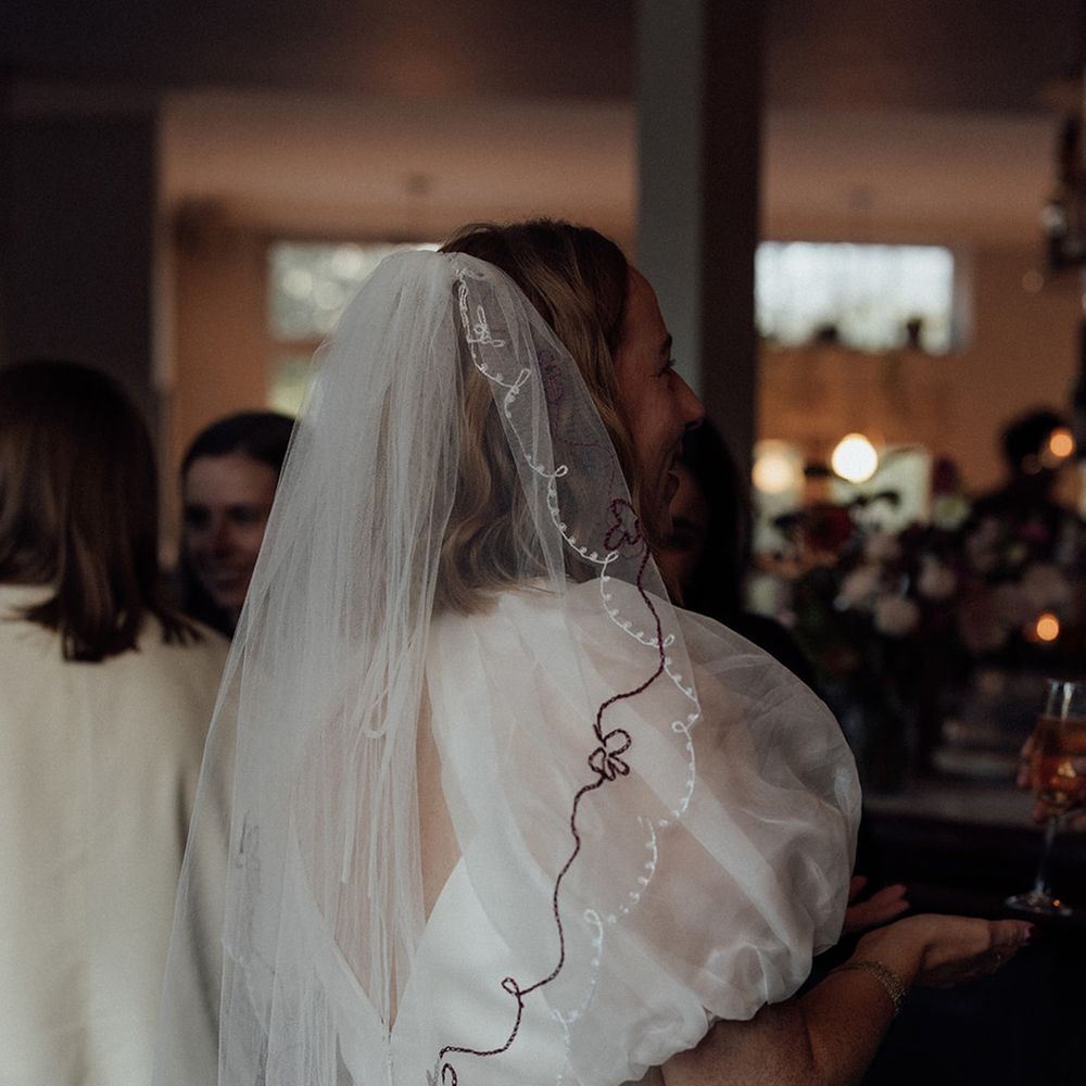 bride-wearing-embroidered-bow-wedding-veil