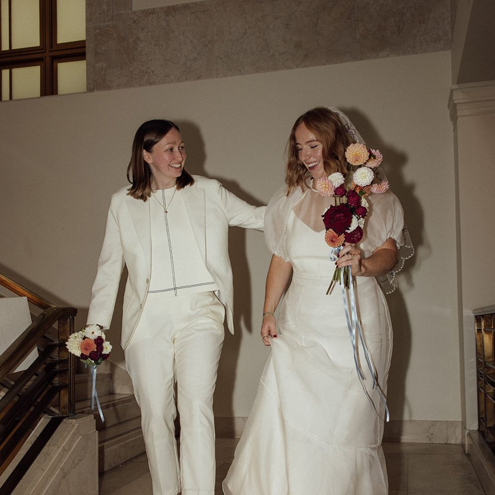 brides-walking-down-steps-at-hackney-town-hall