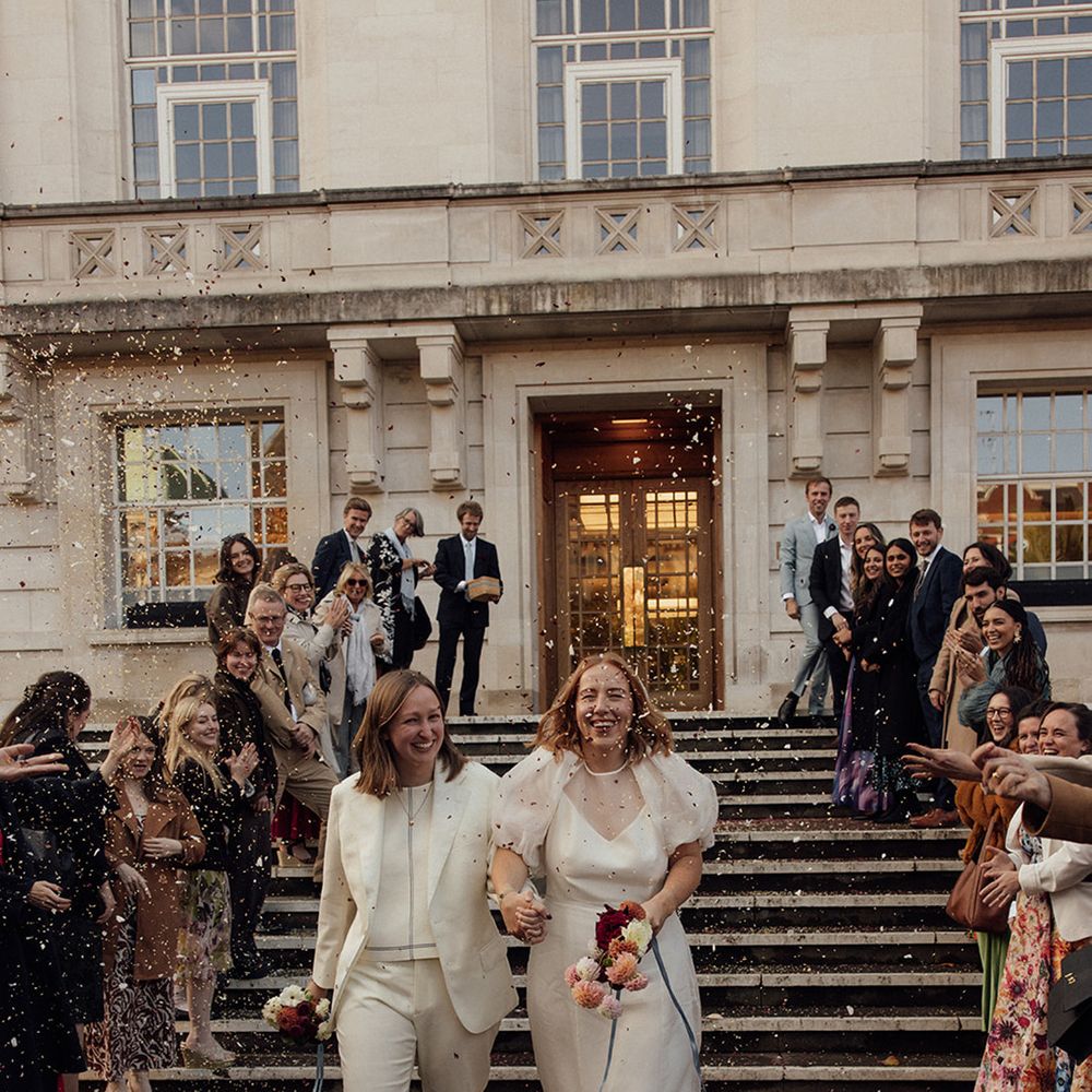 brides-walking-hand-in-hand-at-hackney-town-hall