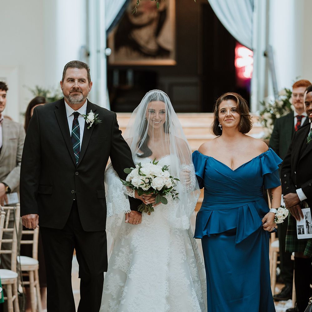 Mother and Father of the bride walking down the aisle together