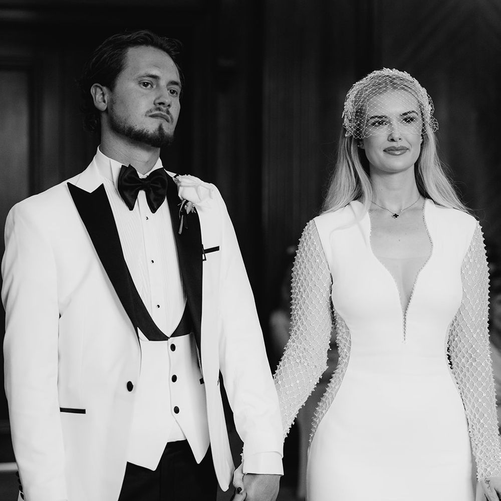 bride-and-groom-holding-hands-at-town-hall-wedding-ceremony