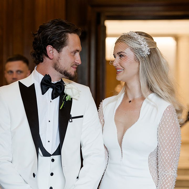 bride-and-groom-looking-into-each-others-eyes-at-wedding-ceremony