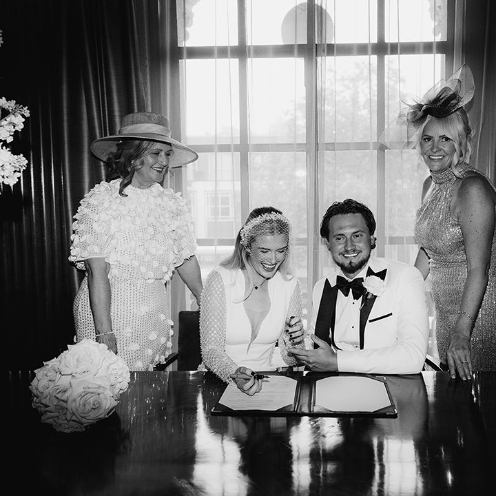 bride-and-groom-sign-the-wedding-register
