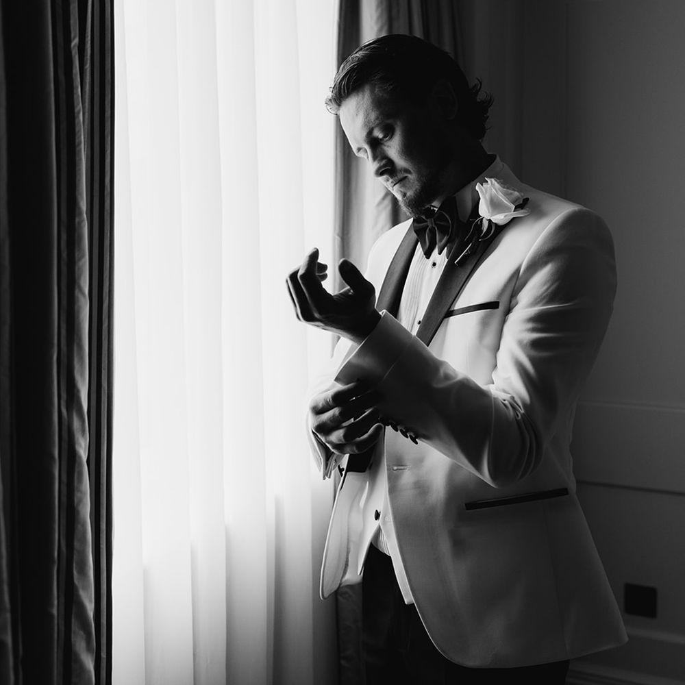groom-in-white-tuxedo