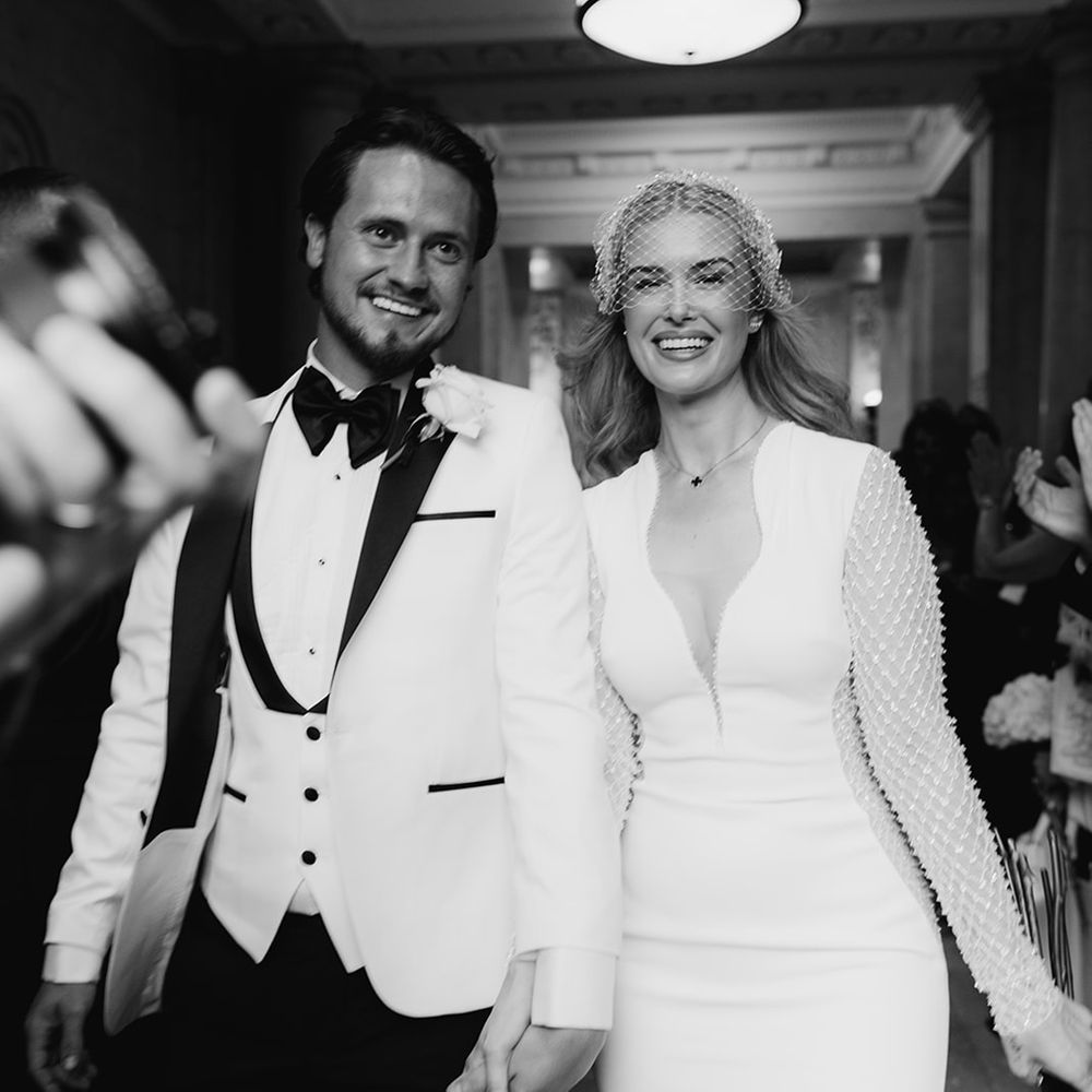 guests-clap-as-bride-and-groom-exit-their-wedding-ceremony