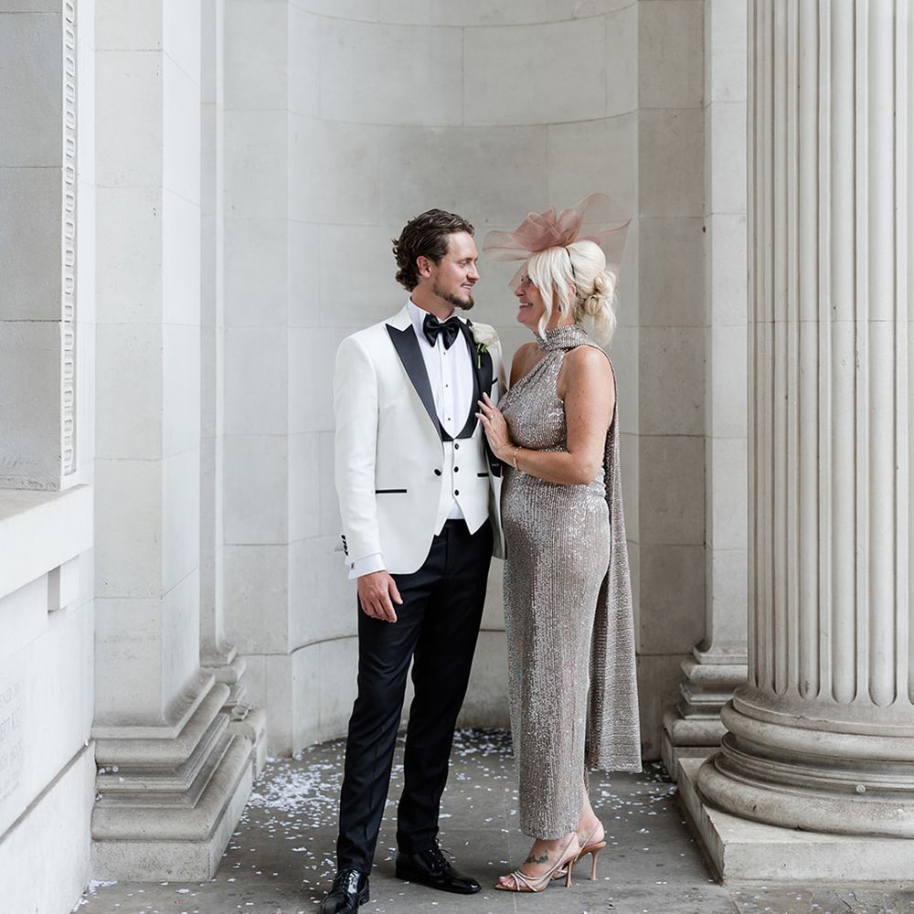 mother-of-the-groom-in-sparkly-dress-with-groom-in-black-white-tuxedo