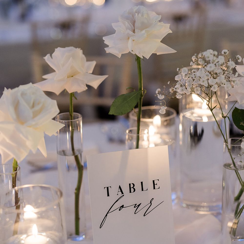 table-name-signage-with-white-roses