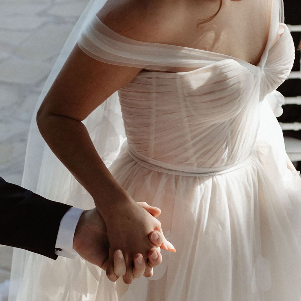 Bride wearing corset tulle wedding dress