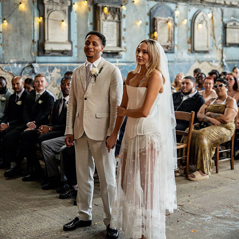 Bride wearing corset wedding dress with sheer maxi skirt 