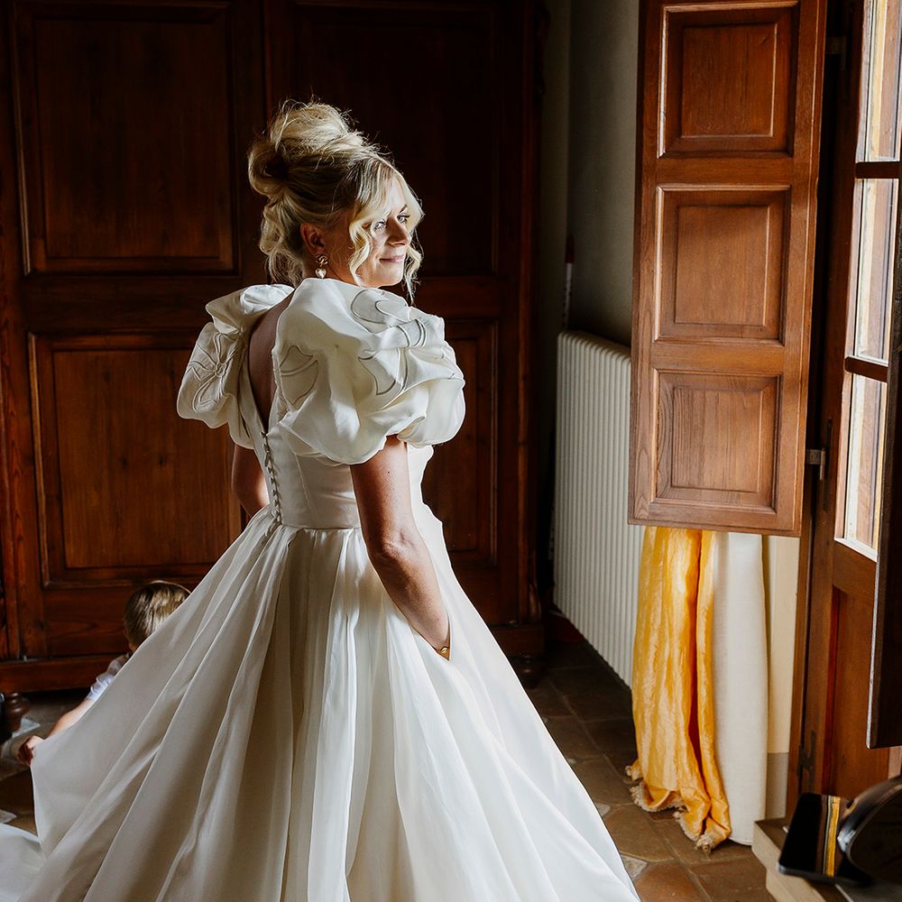 bride-in-puff-sleeve-embroidered-wedding-dress