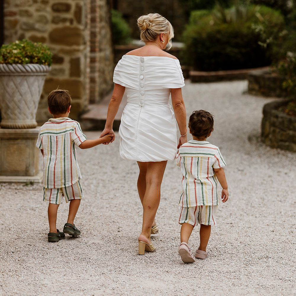 bride-in-short-off-the-shoulder-dress-with-sons-in-matching-striped-outfits