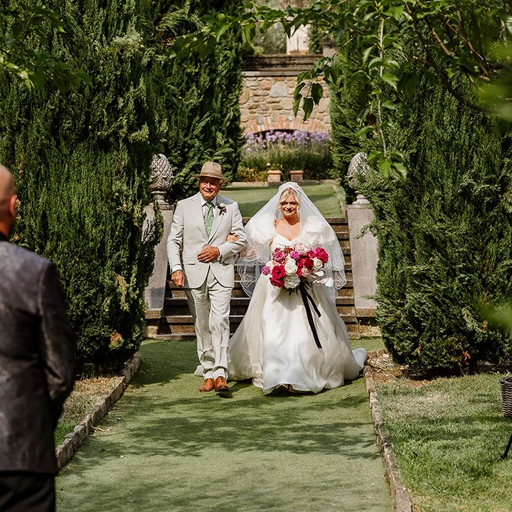 groom-sees-bride-walking-down-the-aisle