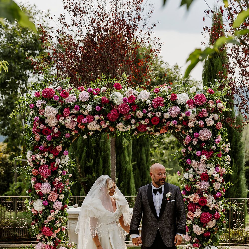 pink-flower-arch-for-outdoor-tuscany-wedding-ceremony