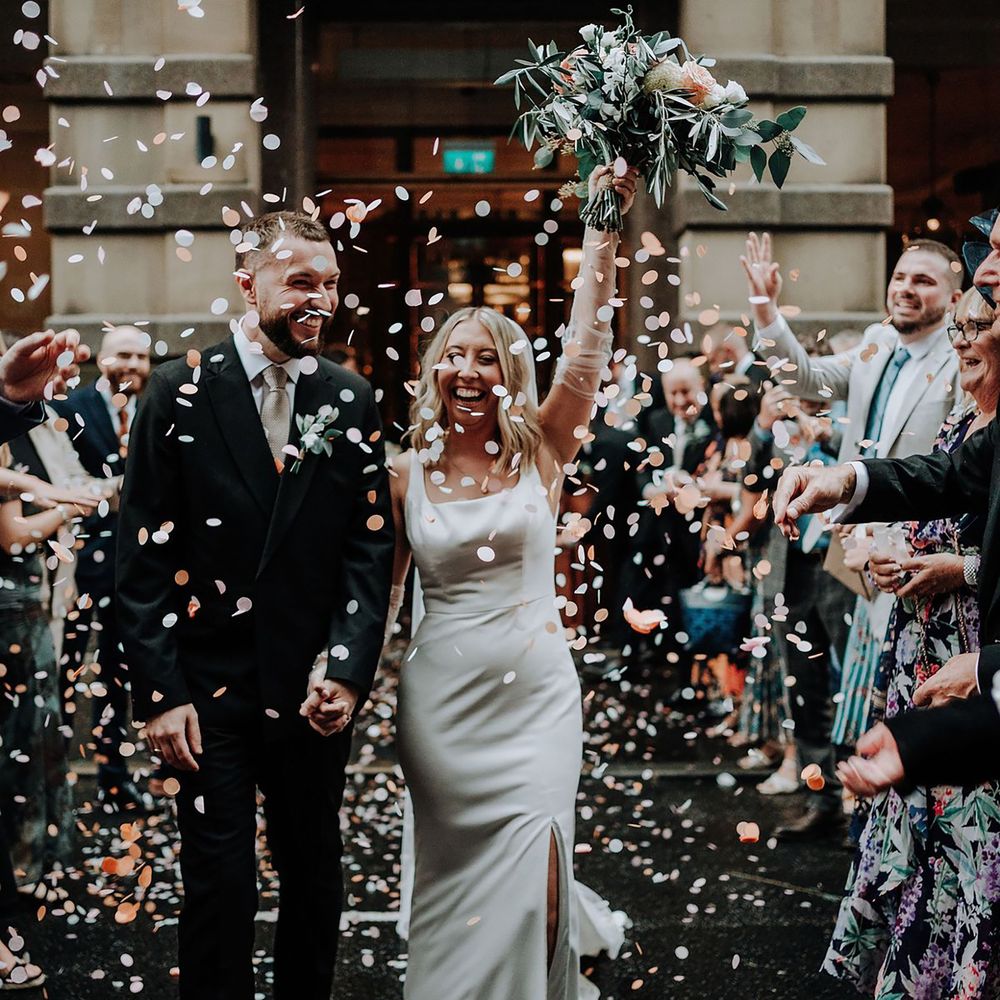 Wedding confetti exit at city wedding