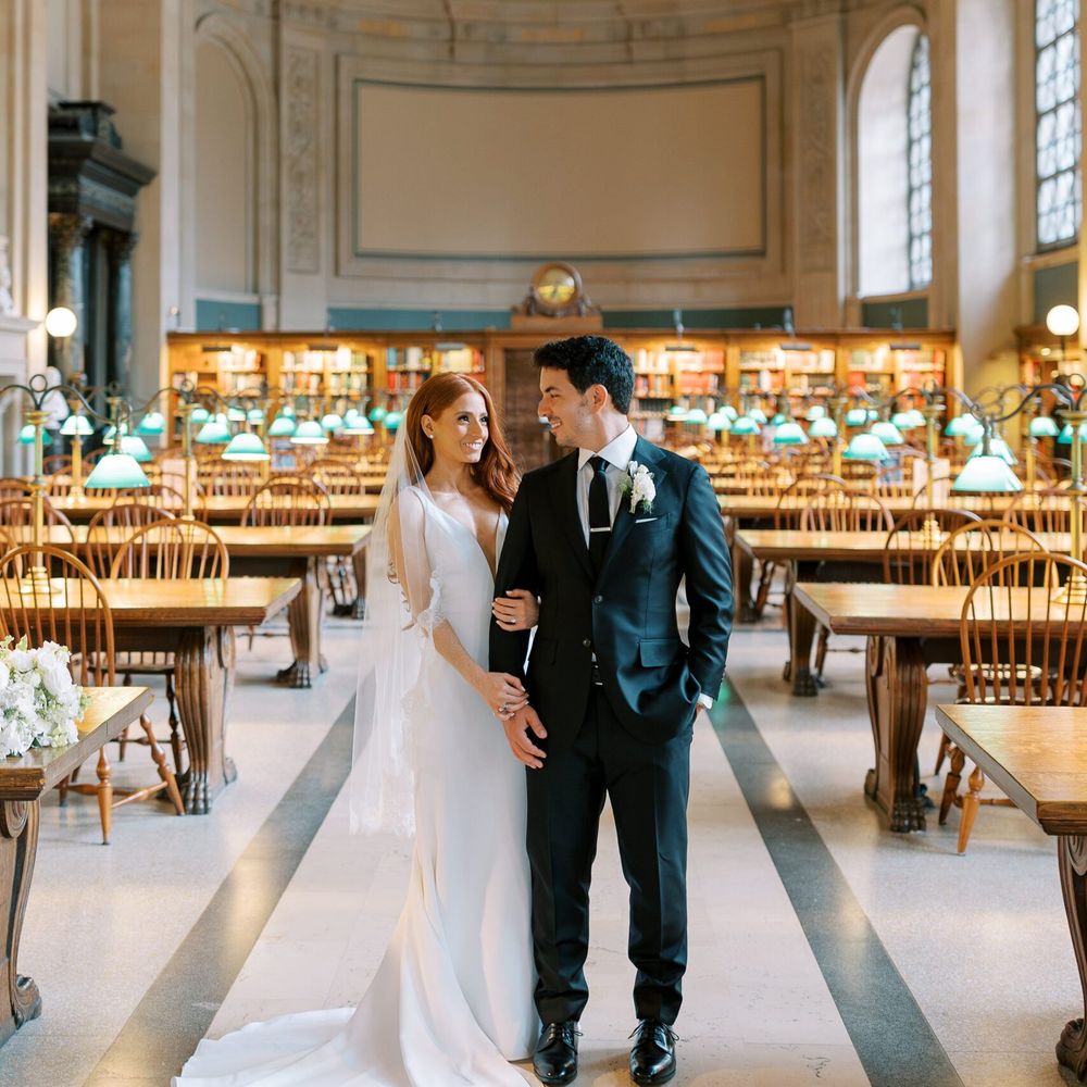 Couple walks together at Boston Public Library 