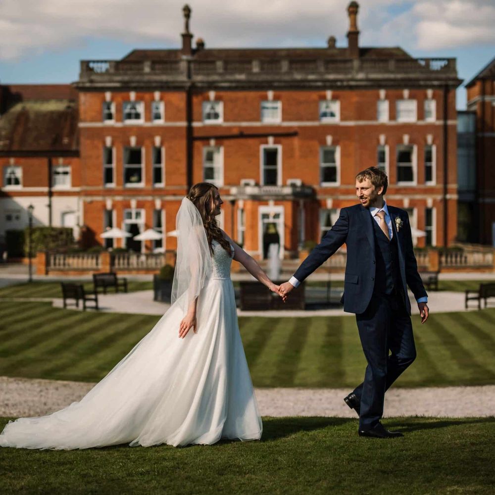 Couple walks around Oakley Hall Hotel