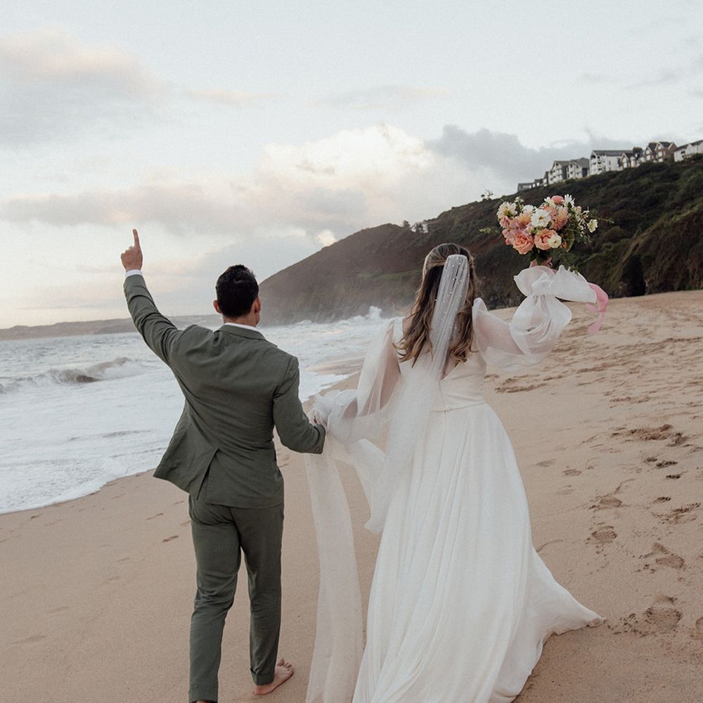 beach-wedding-as-couple-walks-in-the-sand