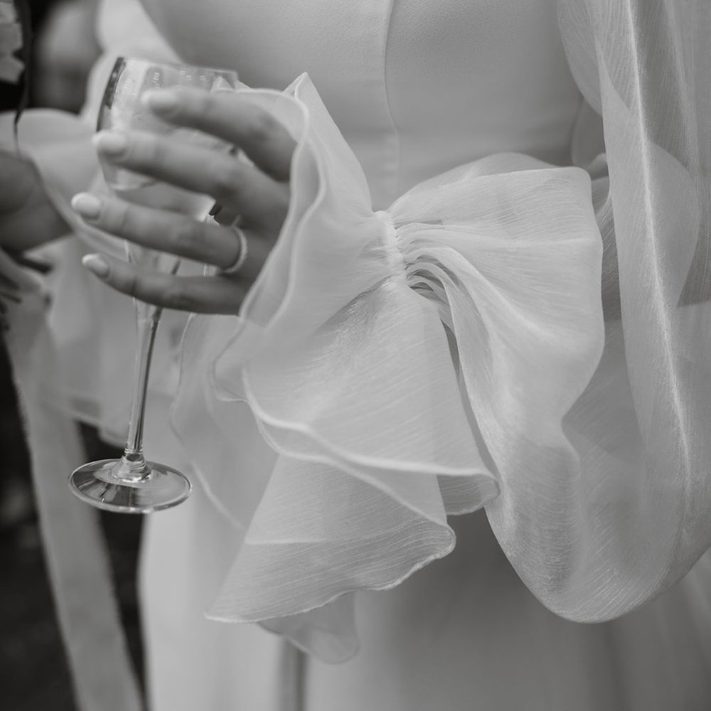 bride-wearing-ruffle-sleeve-wedding-dress