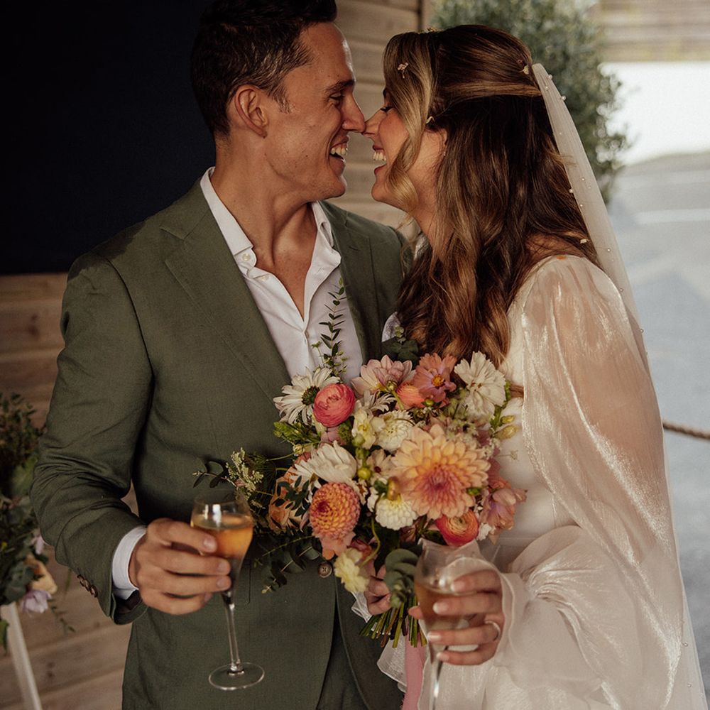 couple-smiling-at-beach-wedding