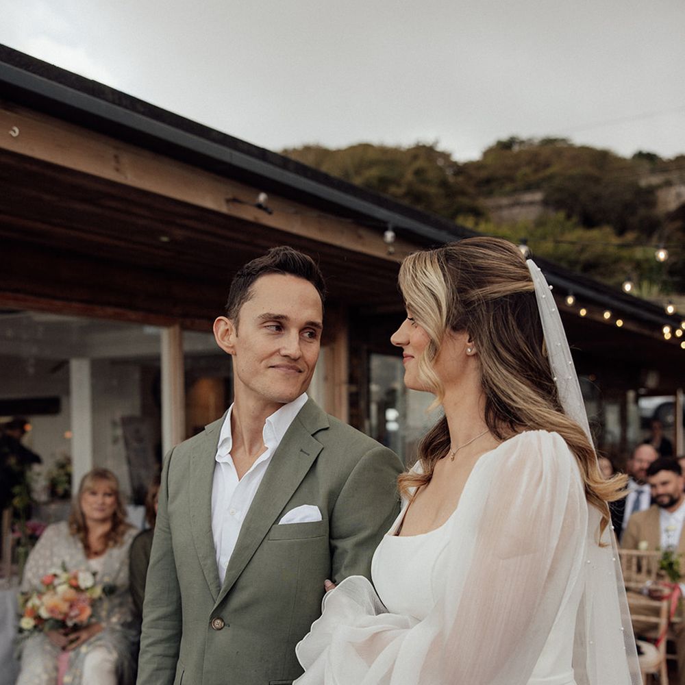 couple-smiling-during-their-wedding-ceremony