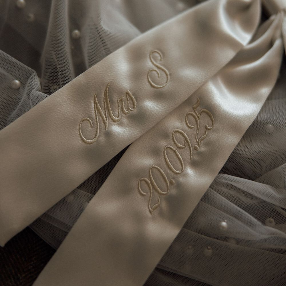 embroidered-white-satin-bow-accessory