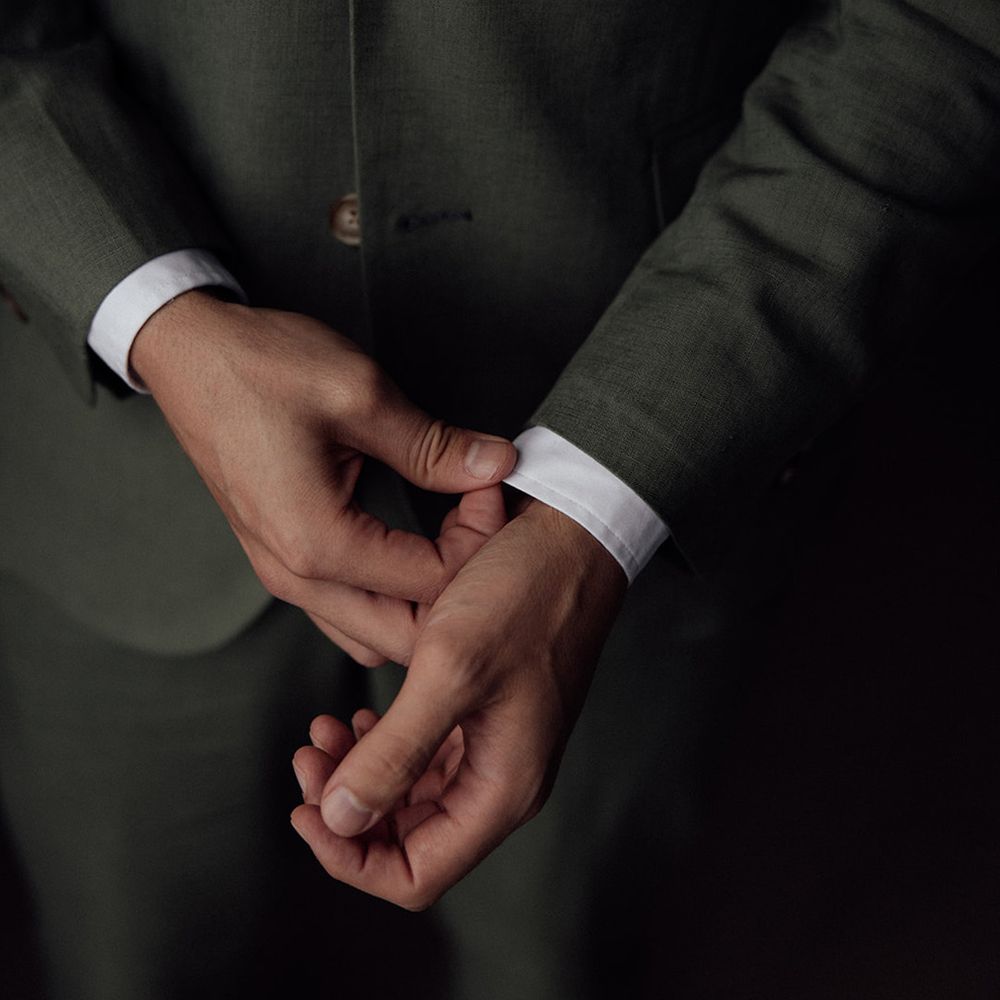 groom-in-dark-green-wedding-suit