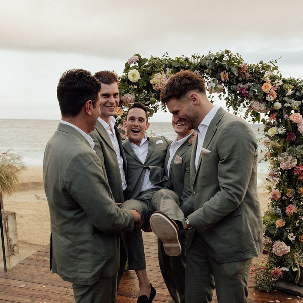 groom-lifted-by-groomsmen