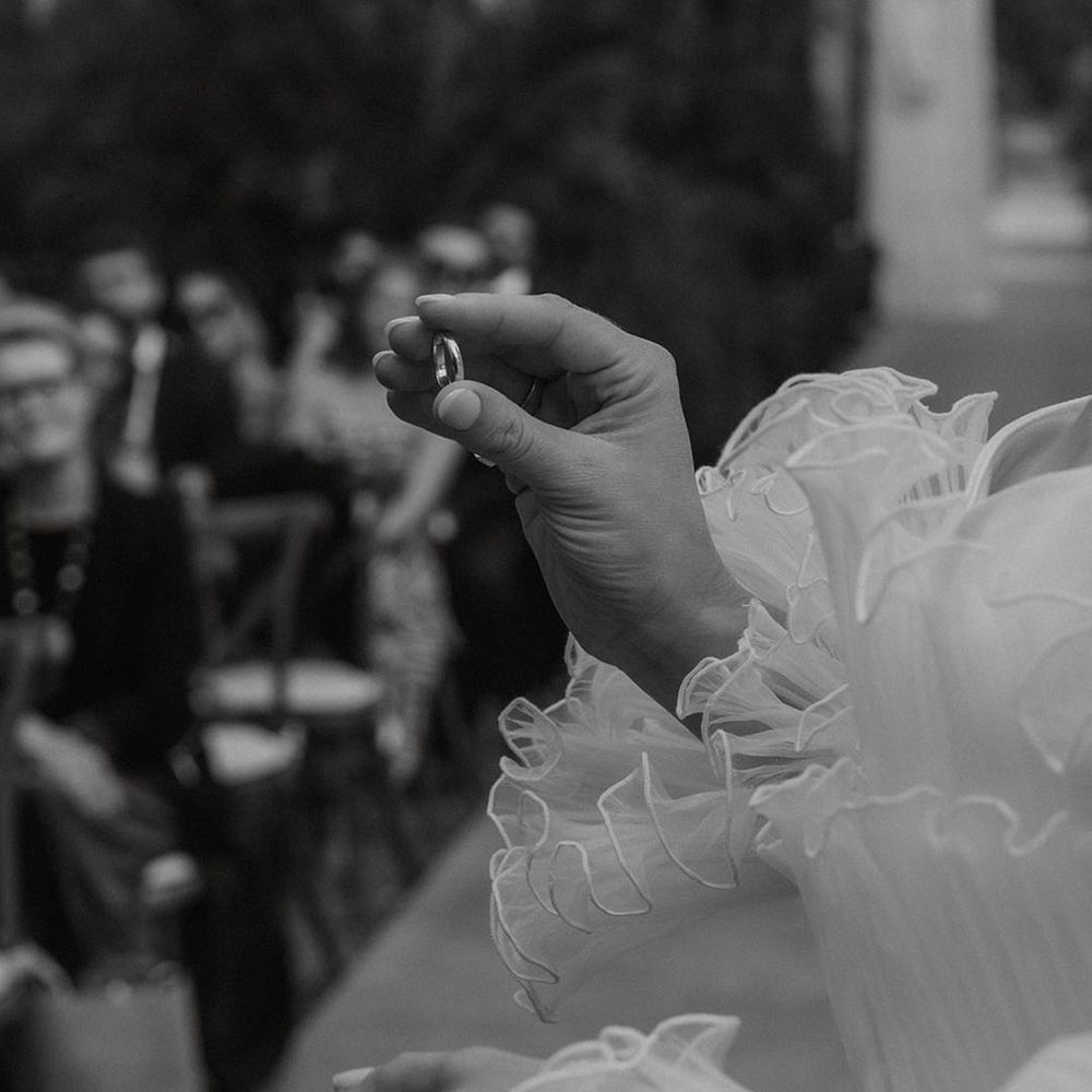 bride-placing-ring-on-grooms-finger
