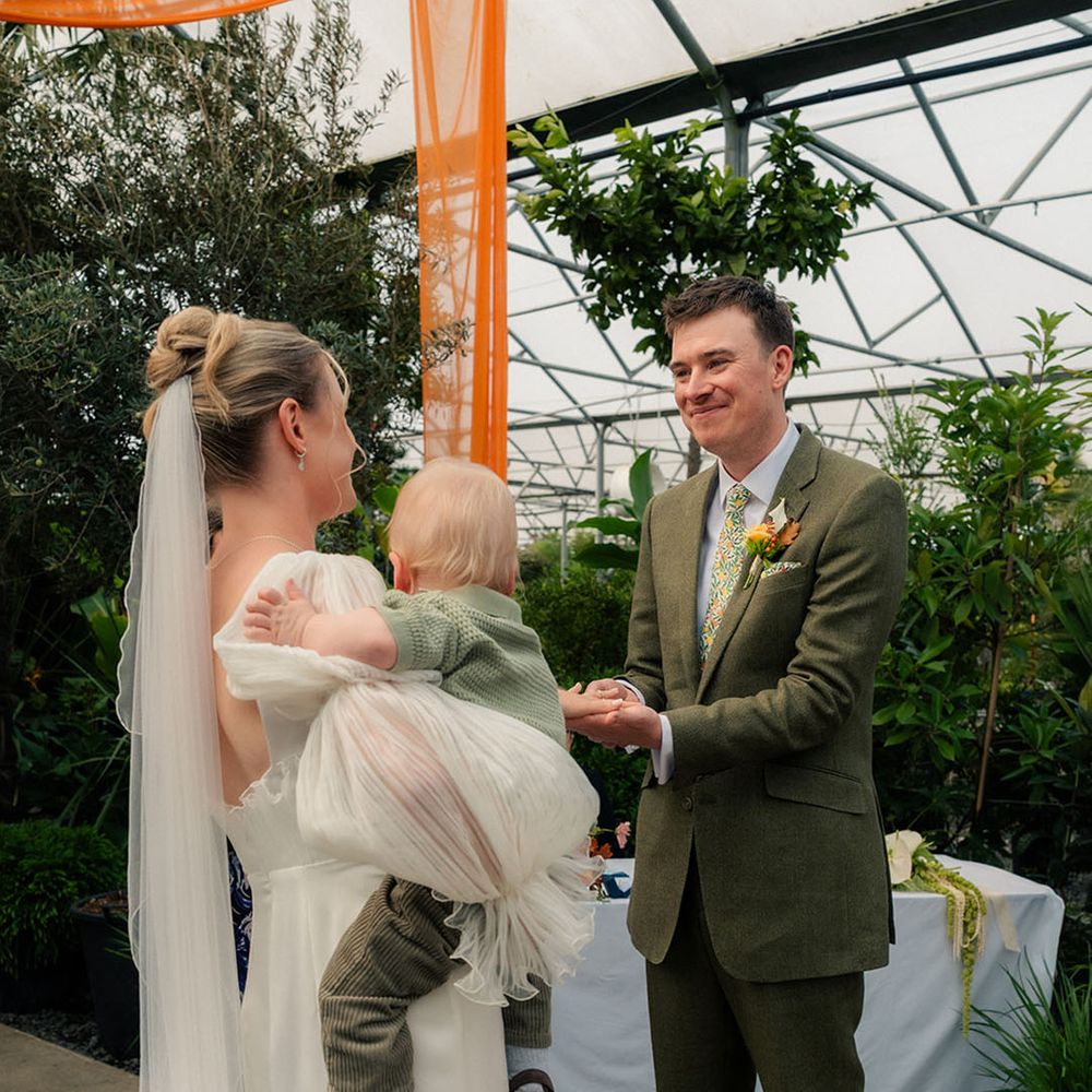 couple-ceremony-with-their-child-involved-in-the-vows