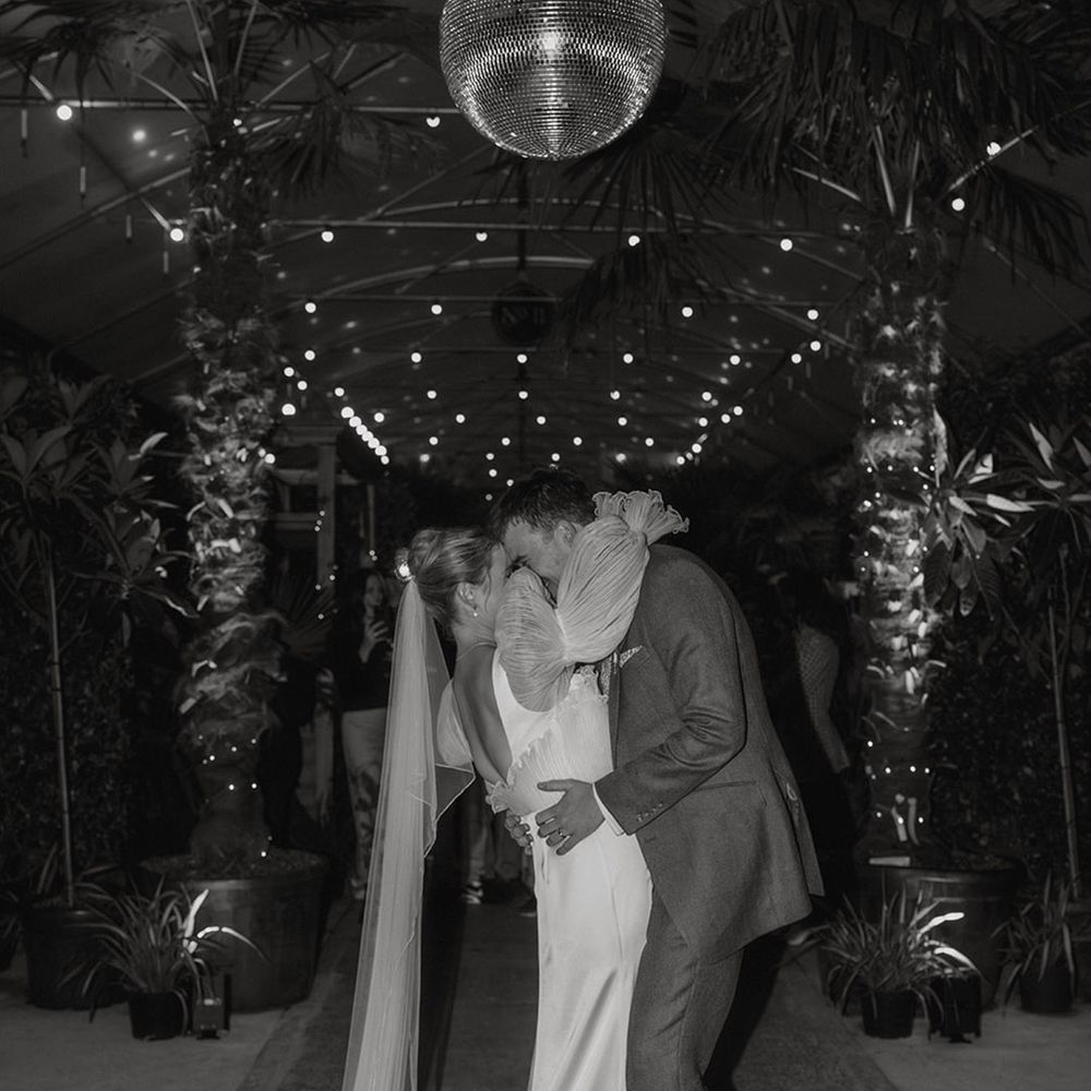 couple-kisses-under-disco-ball.