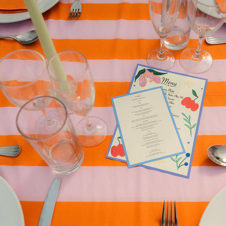 pink-orange-striped-table-with-personalised-stationery