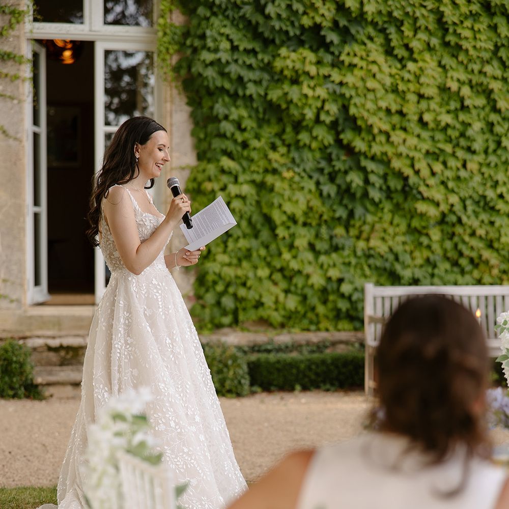 Bride speech at outdoor wedding