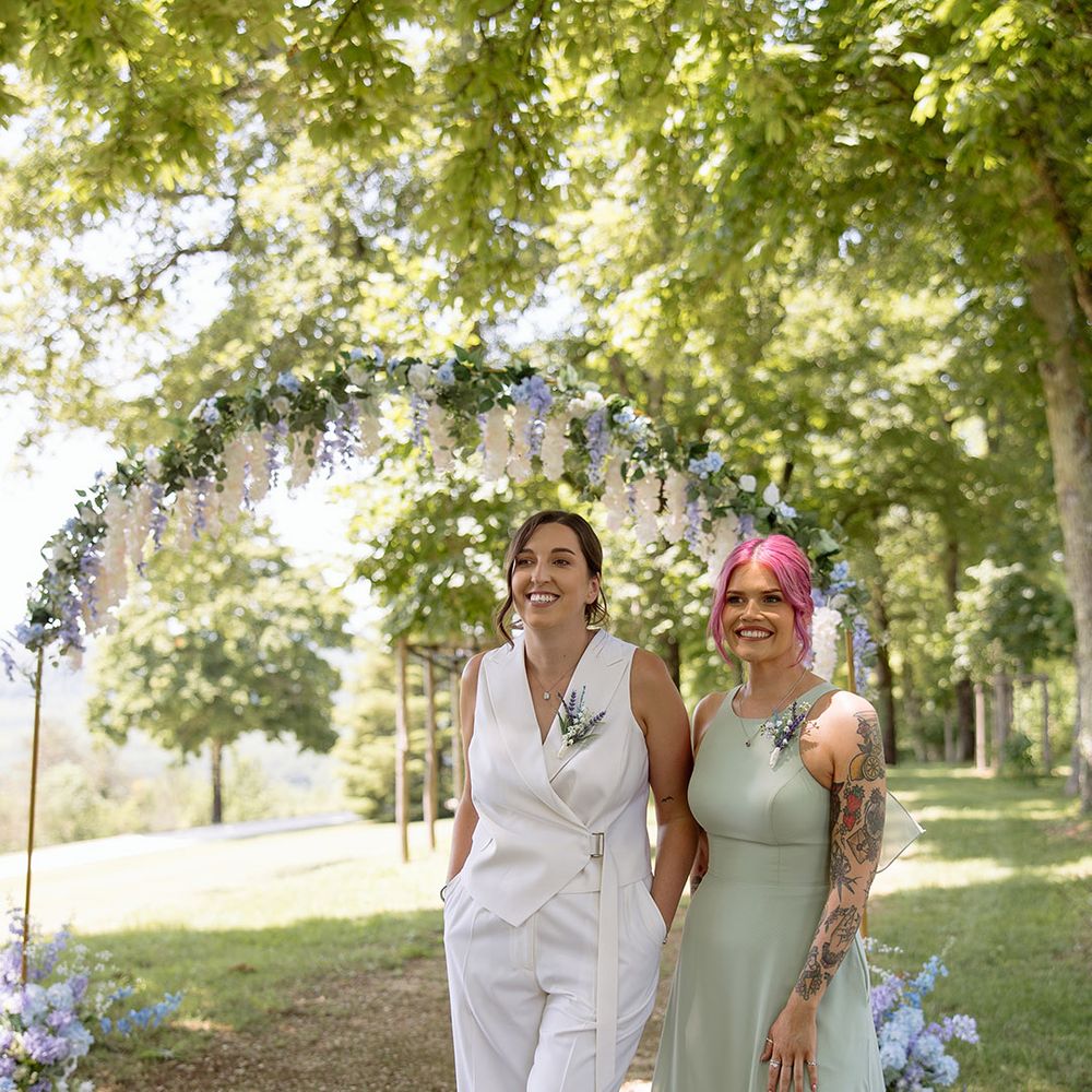 Bride waiting at the aisle with maid of honour for other bride